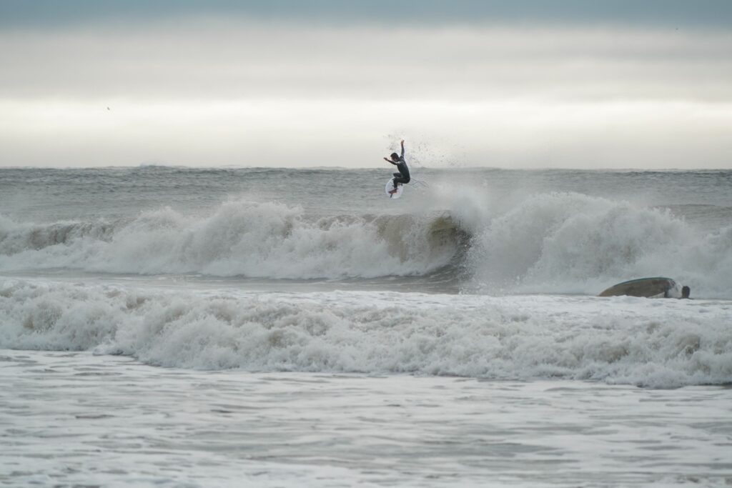 Mikey C throwing a straight air in the Buell RB1 Accelerator wetsuit.